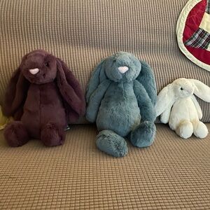 Jellycat of London, two retired medium bunnies, one retired small bunny.